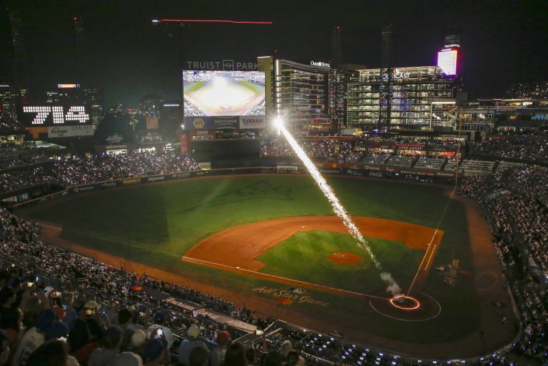 A high-tech recreation of Hank Aaron's 715th homerun streaks across a baseball field